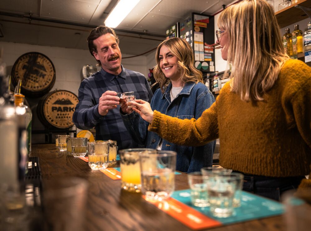 Three people trying gin during the Blend your Own Gin experience at PARK Distillery.